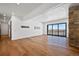 Large living room with hardwood floors and sliding doors to deck at 5320 Dual Rey Pt, Sedalia, CO 80135
