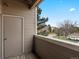 Private balcony offers a peaceful view of the community, perfect for relaxing or entertaining at 7498 S Alkire St # 202, Littleton, CO 80127
