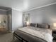 Serene bedroom boasts a large window and relaxing neutral colors, creating a peaceful retreat at 7498 S Alkire St # 202, Littleton, CO 80127