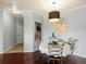 Inviting dining room featuring a decorative light fixture and seating for four, perfect for intimate meals at 7498 S Alkire St # 202, Littleton, CO 80127