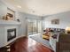 Inviting living room with fireplace, balcony access, and stylish decor for comfortable living at 7498 S Alkire St # 202, Littleton, CO 80127