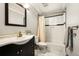 Bathroom featuring a bathtub, shower, vanity, toilet, and marble tile flooring at 8386 S Davco Dr, Morrison, CO 80465