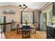 Dining area is well-lit with nice views and an interesting chandelier at 8386 S Davco Dr, Morrison, CO 80465