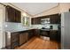 Updated kitchen with granite countertops and dark cabinets at 8386 S Davco Dr, Morrison, CO 80465