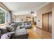 Spacious living room featuring a cozy couch, ceiling fan, and scenic view at 8386 S Davco Dr, Morrison, CO 80465
