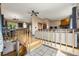 Stairway leads to the living room, dining area and kitchen at 8386 S Davco Dr, Morrison, CO 80465