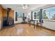 Open concept living room with wood burning stove and hardwood floors at 8386 S Davco Dr, Morrison, CO 80465
