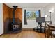 Charming living room featuring a rustic fireplace and scenic views through large windows at 8386 S Davco Dr, Morrison, CO 80465