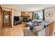 Living room features a wood-burning fireplace and a comfortable gray couch with many decorative pillows at 8386 S Davco Dr, Morrison, CO 80465