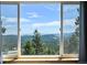 Expansive view through large window with bright sunlight and blue sky at 8386 S Davco Dr, Morrison, CO 80465