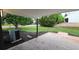 Covered back patio with brick and a view of the backyard at 10297 W Crestone Mtn, Littleton, CO 80127