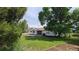 Large backyard with green grass, trees and patio, perfect for outdoor living at 10297 W Crestone Mtn, Littleton, CO 80127