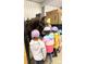 Children learn how to care for horses in a Gathering-friendly barn environment at 10297 W Crestone Mtn, Littleton, CO 80127