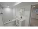 Updated bathroom features a marble-trimmed shower and new vanity at 10297 W Crestone Mtn, Littleton, CO 80127