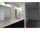 Modern bathroom with white quartz countertops, double sinks, and black fixtures at 10297 W Crestone Mtn, Littleton, CO 80127