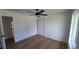 Bedroom featuring wood floors, ceiling fan, and closet at 10297 W Crestone Mtn, Littleton, CO 80127