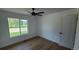 Bedroom featuring hardwood floors, fan, closet, and a view of a park at 10297 W Crestone Mtn, Littleton, CO 80127