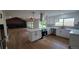 Bright, open kitchen featuring modern appliances, island, and hardwood floors with access to living room at 10297 W Crestone Mtn, Littleton, CO 80127