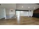 Living room featuring hardwood floors and open staircase at 10297 W Crestone Mtn, Littleton, CO 80127