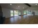 Bright living room with access to a patio, with open concept to the modern kitchen at 10297 W Crestone Mtn, Littleton, CO 80127