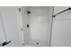 Modern shower featuring sleek tile and a matte black shower head at 10297 W Crestone Mtn, Littleton, CO 80127