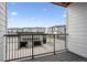 View from the balcony showing a garage and neighboring buildings at 485 Interlocken Blvd # 209, Broomfield, CO 80021