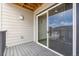 Outdoor balcony with sliding glass doors and wood flooring at 485 Interlocken Blvd # 209, Broomfield, CO 80021