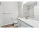 Clean, well-lit bathroom features a modern vanity, with neutral countertops, sink, and bath tub at 485 Interlocken Blvd # 209, Broomfield, CO 80021