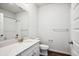 Bathroom featuring single vanity with quartz countertop, hardwood floors and a shower at 485 Interlocken Blvd # 209, Broomfield, CO 80021