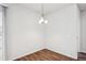 Bright dining area featuring wood-look floors and a chandelier at 485 Interlocken Blvd # 209, Broomfield, CO 80021