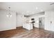 Bright, open concept living space with island kitchen and wood-look flooring at 485 Interlocken Blvd # 209, Broomfield, CO 80021