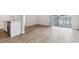 Bright kitchen features an island with granite countertop, stainless steel appliances, and hardwood floors at 485 Interlocken Blvd # 209, Broomfield, CO 80021