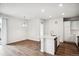 Bright, open concept room features an island kitchen and living space at 485 Interlocken Blvd # 209, Broomfield, CO 80021