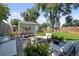 Inviting backyard featuring a fire pit, patio seating, dining area, and lush lawn, perfect for outdoor enjoyment at 2649 N Cook St, Denver, CO 80205