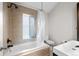 Bathroom featuring a soaking tub, shower, and modern vanity at 2649 N Cook St, Denver, CO 80205
