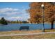 City Park scene with lake view and a bench by the water at 2649 N Cook St, Denver, CO 80205