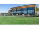 Modern City Park Golf Course clubhouse with floor-to-ceiling windows and outdoor dining area at 2649 N Cook St, Denver, CO 80205