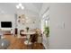 Cozy dining area with a built-in banquette, modern table, and gallery wall at 2649 N Cook St, Denver, CO 80205