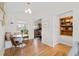 Bright dining area featuring a built-in bench with window, wood floors and open concept at 2649 N Cook St, Denver, CO 80205