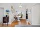 Dining area boasts stylish seating, wood floors, modern decor, and bright natural light at 2649 N Cook St, Denver, CO 80205