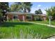 Beautifully landscaped front yard with vibrant green grass and a well-maintained lawn at 2649 N Cook St, Denver, CO 80205