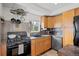Kitchen featuring stainless steel appliances, granite countertops, and ample storage at 2649 N Cook St, Denver, CO 80205
