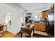 Efficient kitchen featuring modern appliances, an island with storage, and wood floors at 2649 N Cook St, Denver, CO 80205