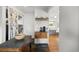 Kitchen with a dark stone island, hard wood floors, and stylish coffee bar at 2649 N Cook St, Denver, CO 80205