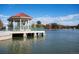 Scenic lakeside gazebo with red roof and green railings at City Park Golf Course at 2649 N Cook St, Denver, CO 80205