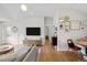 Bright living room with vaulted ceilings, wood floors, and stylish furnishings at 2649 N Cook St, Denver, CO 80205