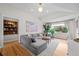 Bright living room with modern furnishings, hardwood floors, and ample natural light at 2649 N Cook St, Denver, CO 80205