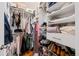 Organized walk-in closet with shelving for clothes, shoes, and storage solutions, maximizing space and accessibility at 2649 N Cook St, Denver, CO 80205