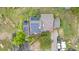 Aerial view of home with solar panels, patio, and well-maintained landscaping at 1777 Main St, Georgetown, CO 80444