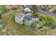 Aerial view of home with solar panels, and mature trees on a large lot at 1777 Main St, Georgetown, CO 80444